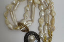 Meaningful pearl necklace with gold accents and teardrop pendant, handmade spiritual jewelry inspired by light and shadow