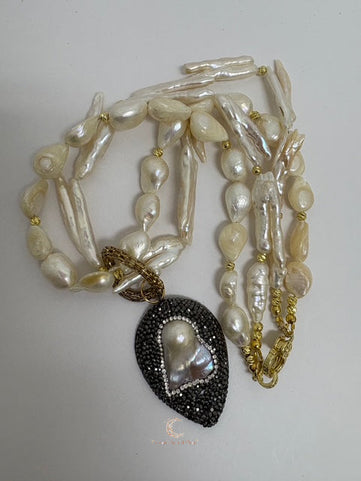 Meaningful pearl necklace with gold accents and teardrop pendant, handmade spiritual jewelry inspired by light and shadow